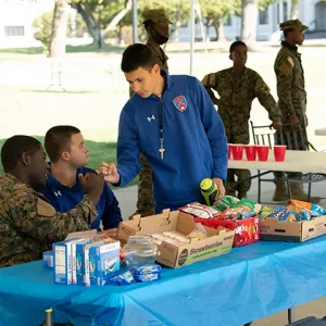 Three teenage friends at snacks table