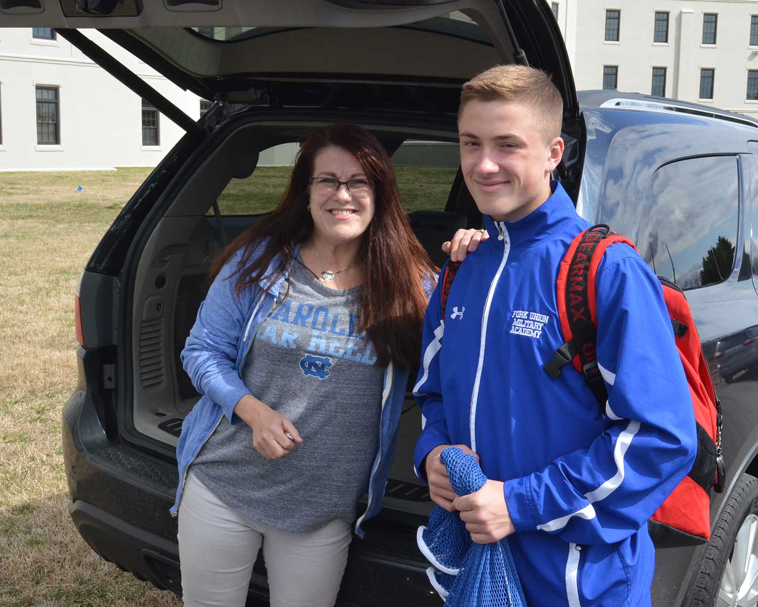 A happy mother and cadet prepare for leave departure.