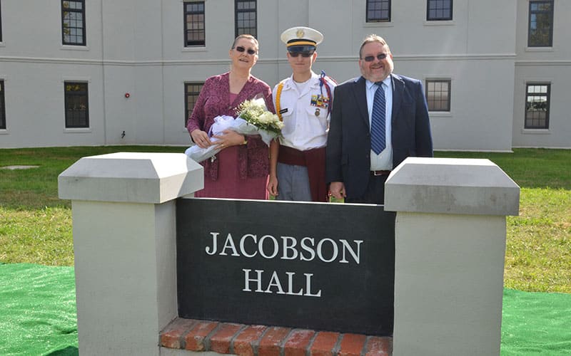 Mr. and Mrs. Jerry Jacobson and son, at the dedication of Jacobson Hall barracks in October 2012.