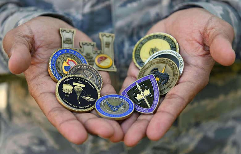 A US Air Force aircrew member displays his challenge coin collection. 
Credit: Defense Visual Information Distribution Service